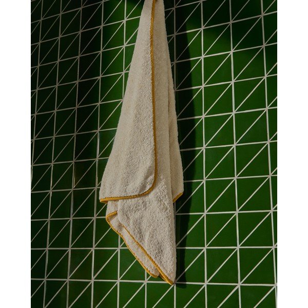 Žlutá/bílá froté bavlněná osuška 70x140 cm Sedora – Kave Home-image-1