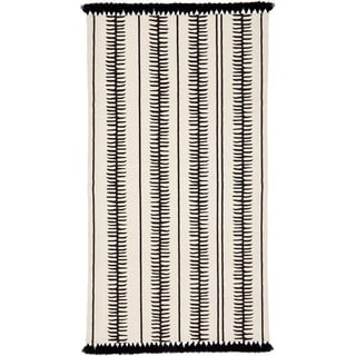 Béžovo-černý ručně tkaný bavlněný koberec Westwing Collection Rita, 70 x 140 cm