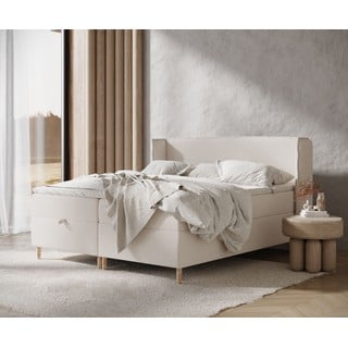 Krémová boxspring postel s úložným prostorem 180x200 cm Monpelli – Maison de Rêve